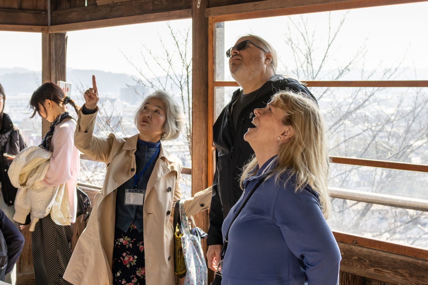 Rene and Claudio with their guide on a mountain viewing deck