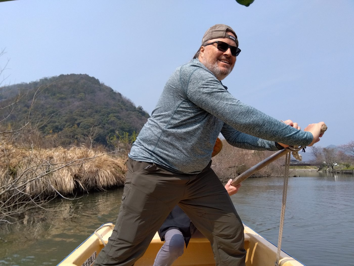 Claudio taking the single oar on the canal boat