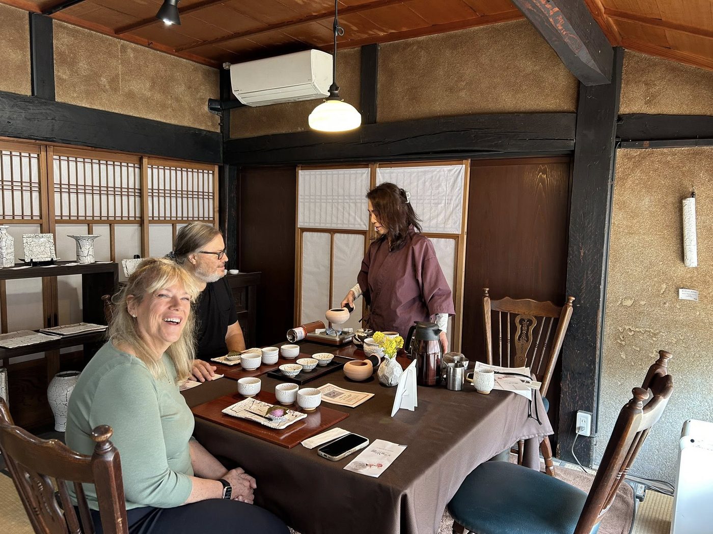 Tea around a table in the potter&rsquo;s old wooden house